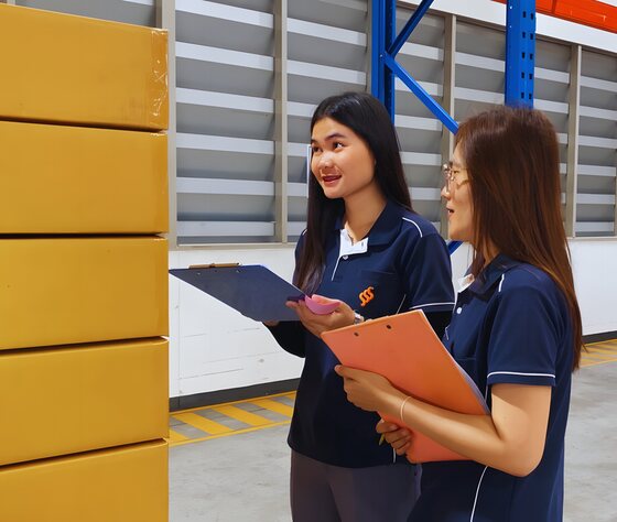 SIS staff checking a shipment